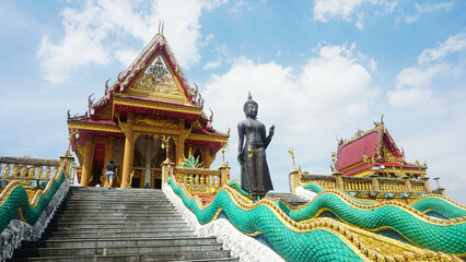 A Beautiful Church in a Buddhist Temple, Standing Buddha statue with The stairway to Wat Ban Ngao...