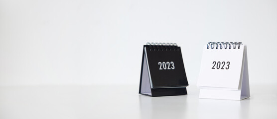 New year 2023 business calendar on office table in new year day. Make a work plan for the start of the year. Concept about Celebration, Business, Christmas, New Year. - obrazy, fototapety, plakaty