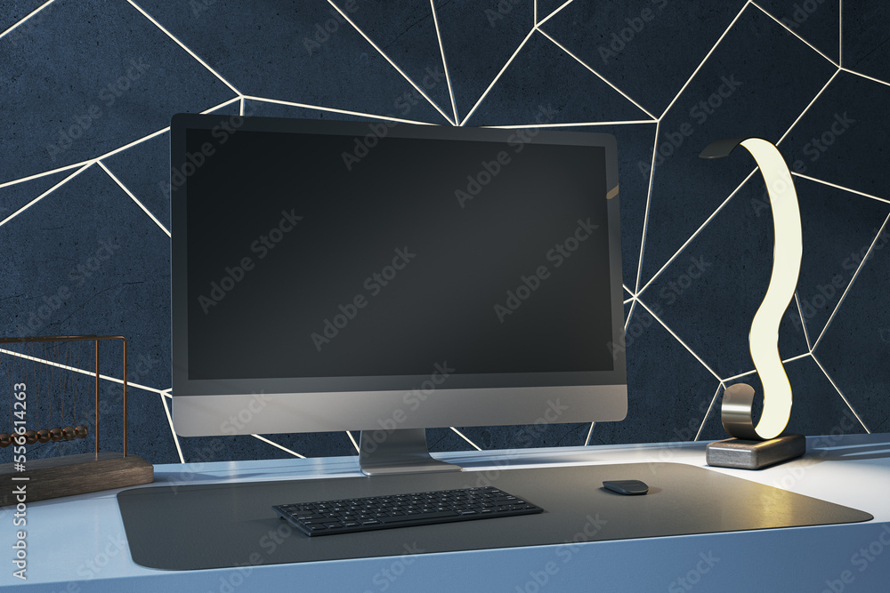 Poster Close up of modern designer desktop with empty black computer monitor, various items and blue wall. Mock up, 3D Rendering.