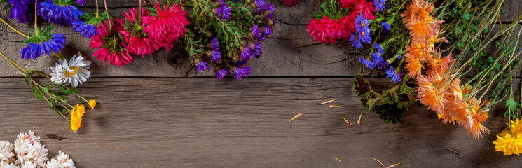 Wild Colorful Rustic Flowers Bouquet from Daisy, Chrysanthemum and Others on Wooden Rustic Table. Mothers Day, Summer and Spring Holidays Wallpaper.