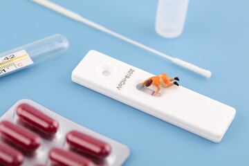 Wipe off the red bar on the antigen kit to turn negative