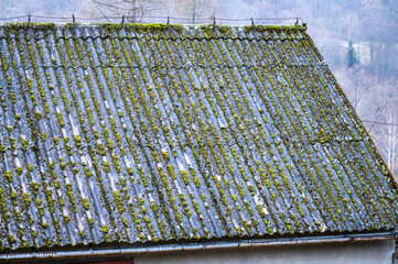Asbestic tile on the barn roof, Bieszczady Mountains, Poland. Dangerous asbestos roofs are still...