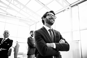 close up. smiling businessman standing in his new office.