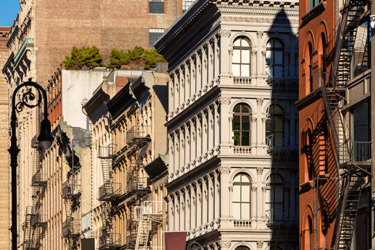 Cast iron facades of Soho loft buildings with fire escapes. Soho Cast Iron Building Historic District along Broadway, Lower Manhattan, New York City