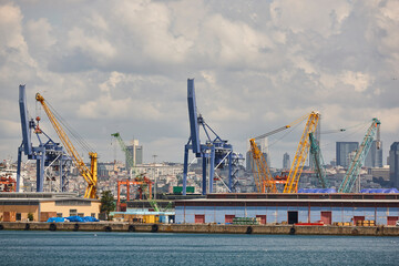 Fototapeta na wymiar Cranes at comercial seaport. Bosphorus strait in Istanbul. Transportation Turkey