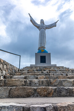 Yungay, Peru - September 16.2022: Statue of Christ in a cemetery in the city of Yungay under Mount Huascaran in Peru