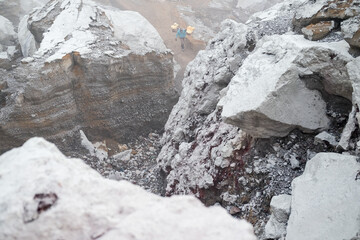 Fototapeta premium Mount Ijen Crater is a tourist spot that has a number of interesting panoramas such as blue fire and sunrise. Tourists can observe the activities of sulfur miners in extreme environments.