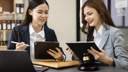 Team lawyer asian women meeting working hard about legal legislation.