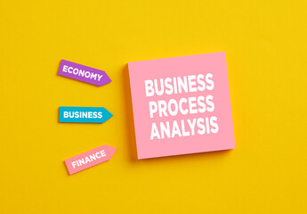 The word business process analysis on pink note paper. Process Action Organization Business System Concept.