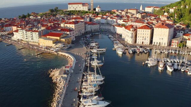 4K aerial - a bird's eye view&nbsp;video (Ultra High Definition) of Piran port. Picturesque summer scene of Slovenia&rsquo;s Adriatic coast with beautiful Venetian architecture.