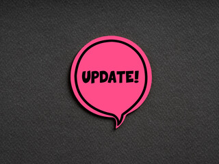 The word update on pink speech bubble on black background. Technology update or upgrade information...