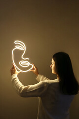 Beautiful girl with neon signs. White neon face. Trendy style. Neon sign. Custom neon. Home decor. Beauty