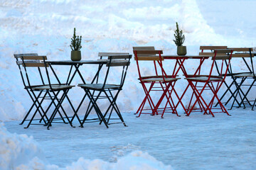 Outdoor cafe tables in winter. Selective sharpness.