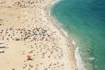 Fototapeta na wymiar Nazare, Portugal - aerial view of the Praia de Nazare,Nazare Beach, and the city of Nazare, in the Leiria District of Portugal