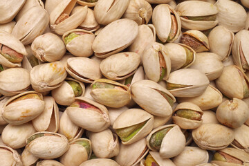 Organic peanuts in shell as background.