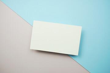 Empty greeting card mockup, horizontal invitation template on blue and pink background