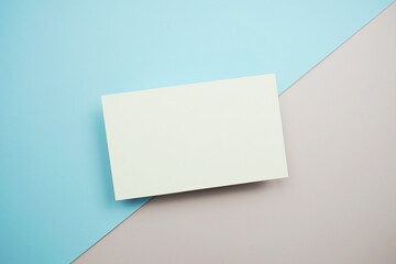Empty greeting card mockup, horizontal invitation template on blue and pink background
