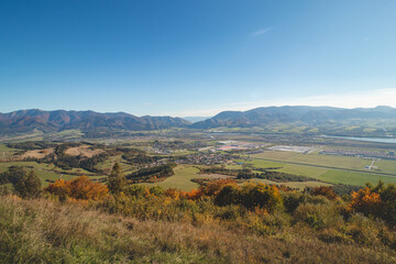Viewpoint from mountain Stranik near Zilina, Slovakia. View of the valley and autumn coloured forests. Beautiful sunny day. Travelling in Eastern Europe