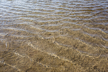 Transparent water and bottom.