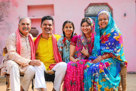 Happy Indian Rural Family Setting At Home.