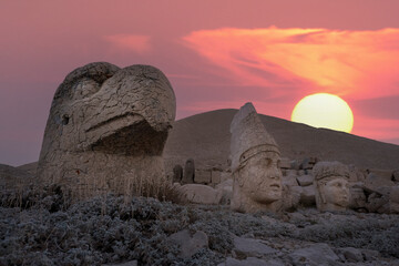 View of mount Nemrut and monumental sculptures of commagene kings and gods with colorful clouds and...
