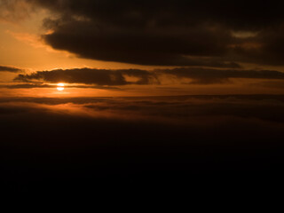 Fototapeta na wymiar Sun Rise Through Clouds