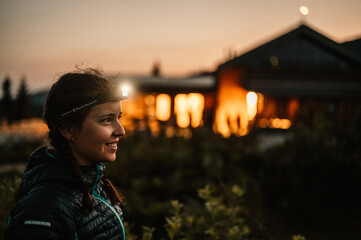 Ridge over the Slovakia mountains mala fatra. Hiking in Slovakia mountains landscape. Woman standing under the starry night sky, lighting with head lamp © Zedspider