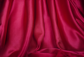 Obraz premium Beautiful wavy bright red curtains close up Blur or Berry
