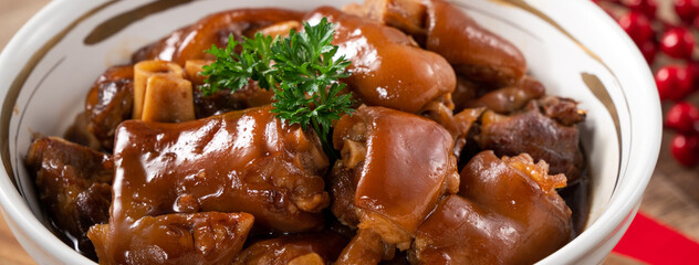 Taiwanese traditional food pork knuckle in a bowl for Chinese Lunar New Year meal.