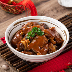 Taiwanese traditional food pork knuckle in a bowl for Chinese Lunar New Year meal.