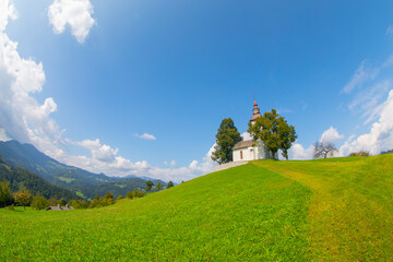 Praprotno, Skofja Loka - Slovenia. Hilltop church of Sveti Tomaz, amazing scenic postcard Kamnik–Savinja Alps.