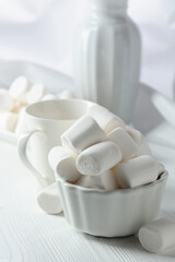 White marshmallows on a wooden table.