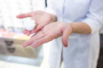 Close up of females hands holding contact lenses
