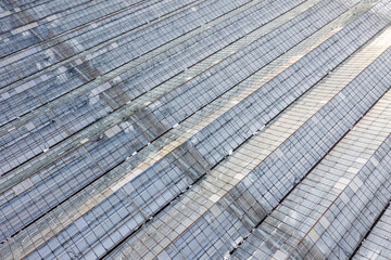 Fototapeta premium Greenhouse farm in winter top view.