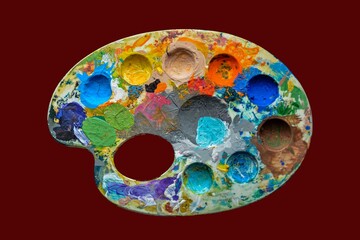 top view of palette with colorful paints isolated on grey