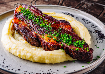 Beef brisket slice and mashed potato on white plate
