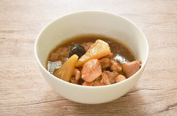 boiled chicken meat with pineapple in sweet red gravy sauce stew on bowl