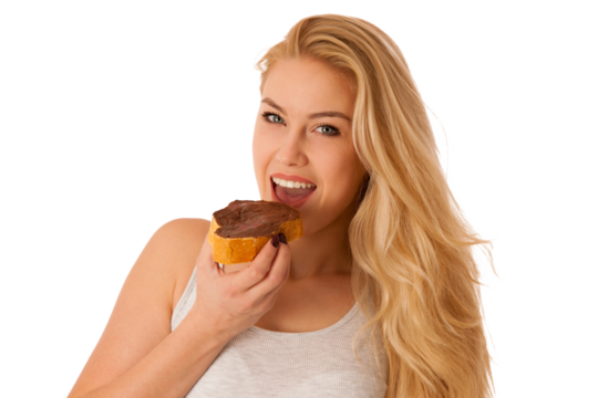 Young blond woman eating breakfast bread and nougat spread isolated over white background