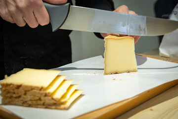 Famous and tasted part of cheese has been cuted with a wire