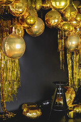 Interior with golden balls on black background