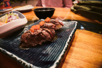 Grill meat sushi on plate at Japanese restaurant 