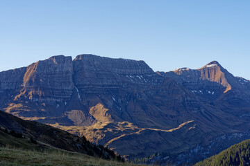 Scenic view from top of Axalp over Bernese Oberland with beautiful mountain panorama of the Swiss Alps on a sunny autumn day. Photo taken October 18th, 2022, Axalp, Switzerland.