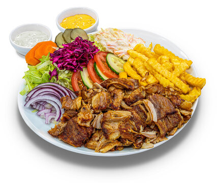 Doner kebab with french fries and salad on a white plate, isolated