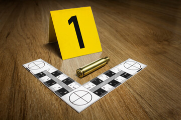 Crime Scene Investigation - .357 bullet casing as a piece of evidence placed with forensic ruler...