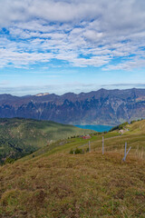 Beautiful aerial view over Lake Brienz with autumn landscape seen from top of Axalp, Canton Bern, on a sunny day. Photo taken October 18th, 2022, Axalp, Switzerland.