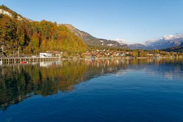 Beautiful scenic autumn landscape with Lake Brienz in the foreground at Bernese Oberland, Canton Bern, on a sunny autumn afternoon. Photo taken October 18th, 2022, Brienz, Switzerland.