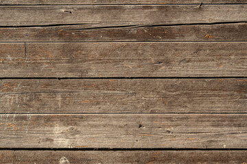 Background of poorly processed wooden boards with gaps between them