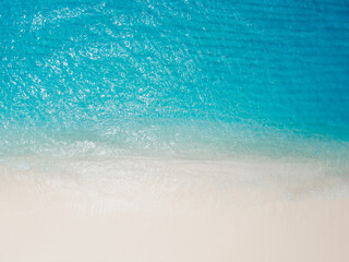 Fototapeta na wymiar Paradise beach with white sand and blue ocean. Aerial view of holidays beach on Hawaii island