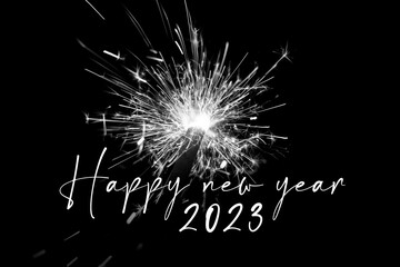 Happy new year 2023 white sparkler new years eve countdown. Luxury entertainment celebration turn of the year party time. Premium nightlife visual with glowing light sparks on dark background - 556687033