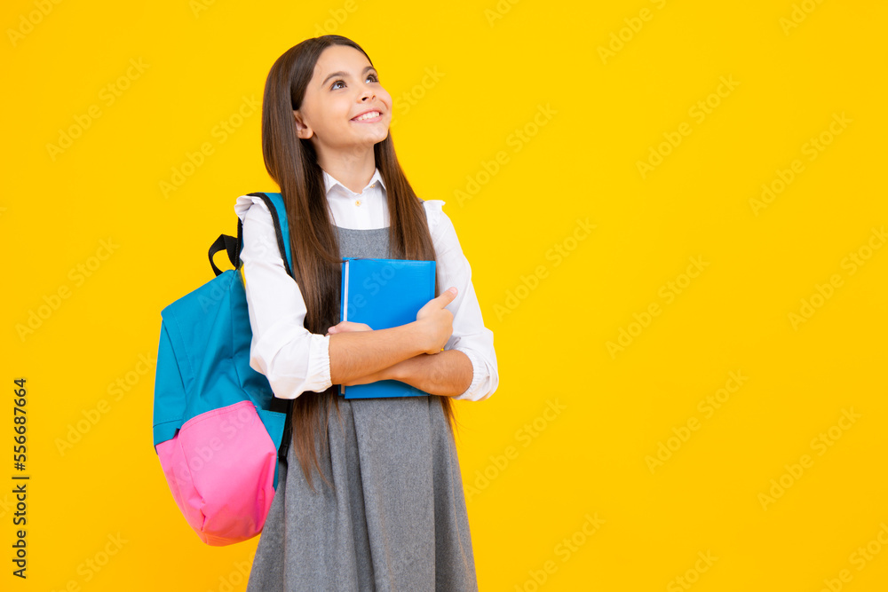 Canvas Prints schoolchild, teenage student girl hold book on yellow isolated studio background. school and educati